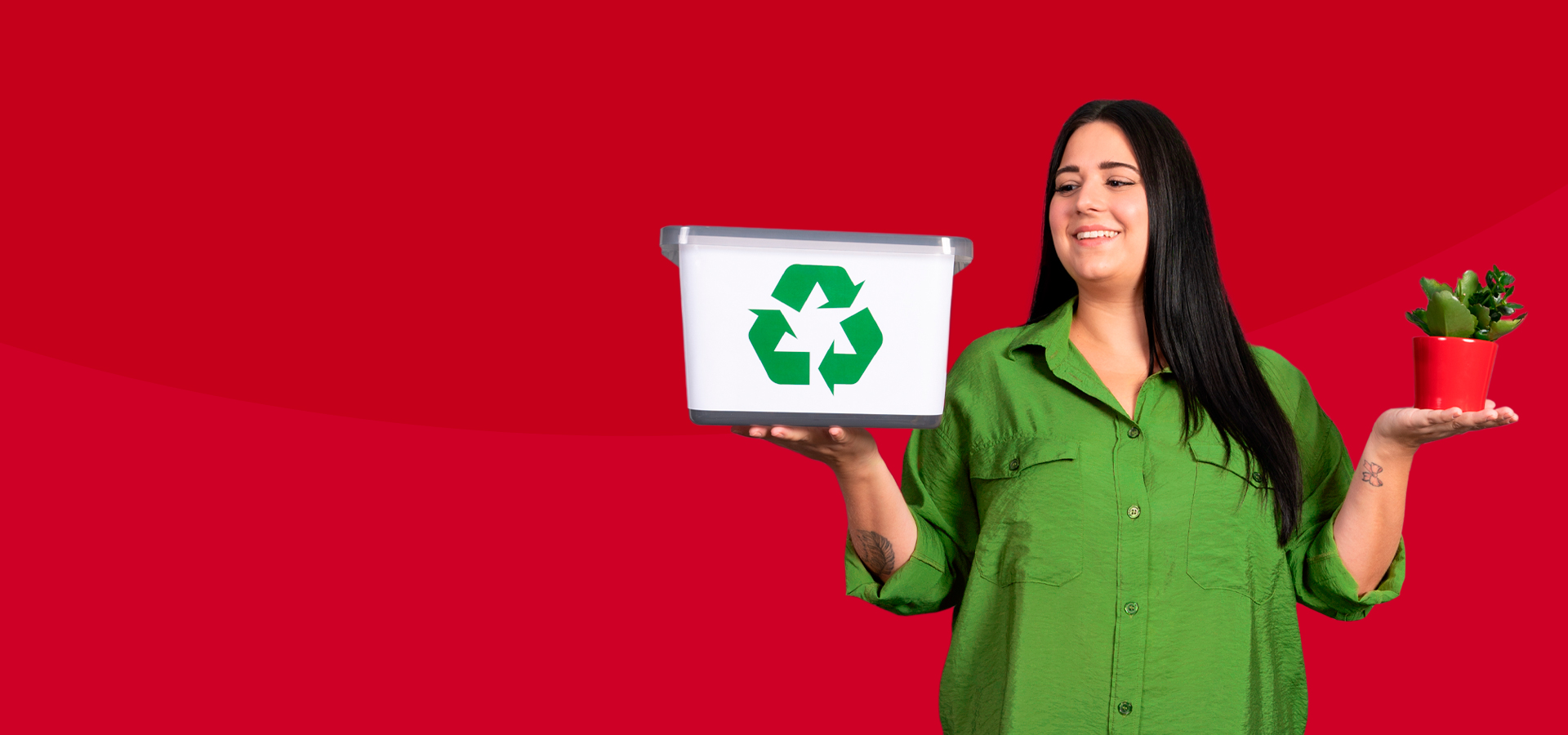 Woman holding a flower pot in the right hand and a box with recycling sign in left hand